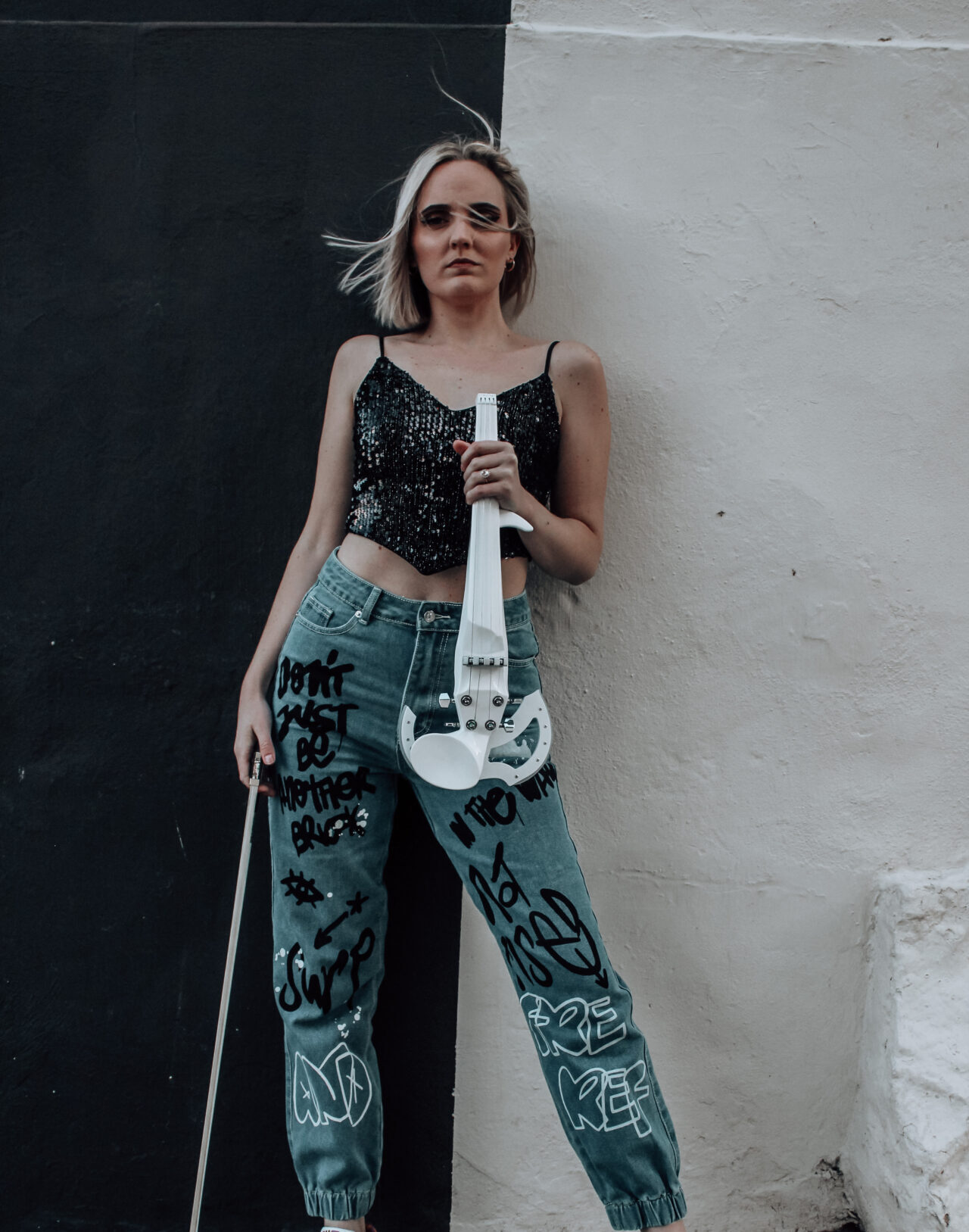 Donne Violinist posing in the streets of Cape Town with her electric violin