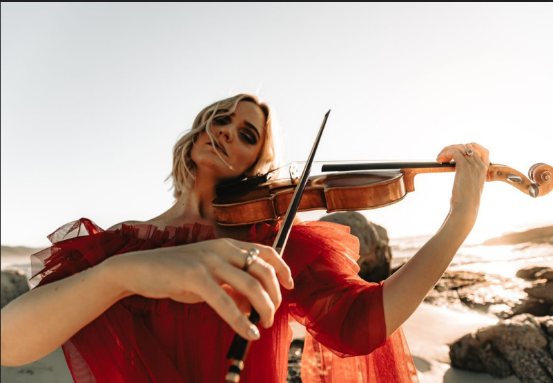 Sunset violin at Noordhoek beach.